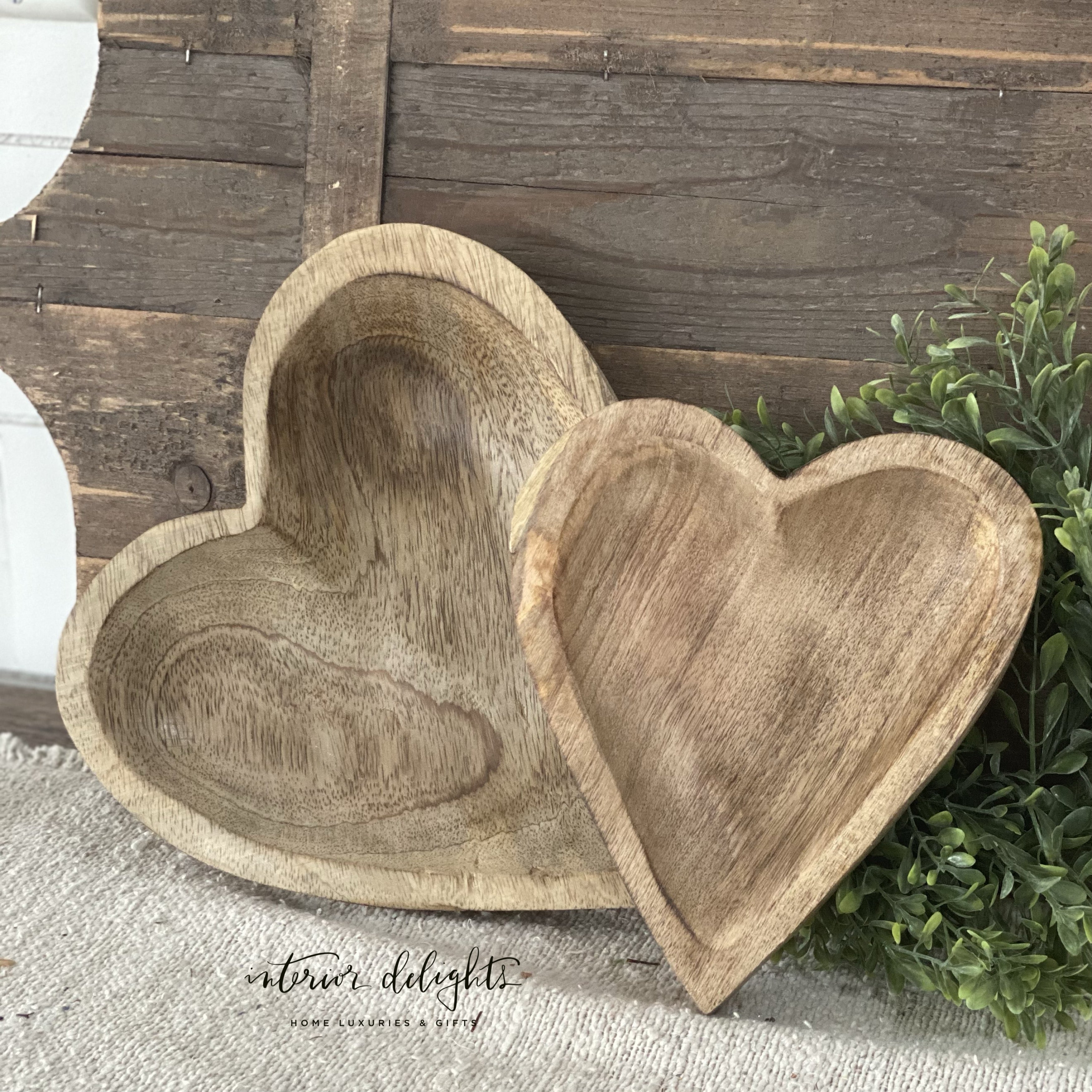 Wood Carved Hearts - Set of 2, showcasing unique designs and felt pads to protect surfaces.
