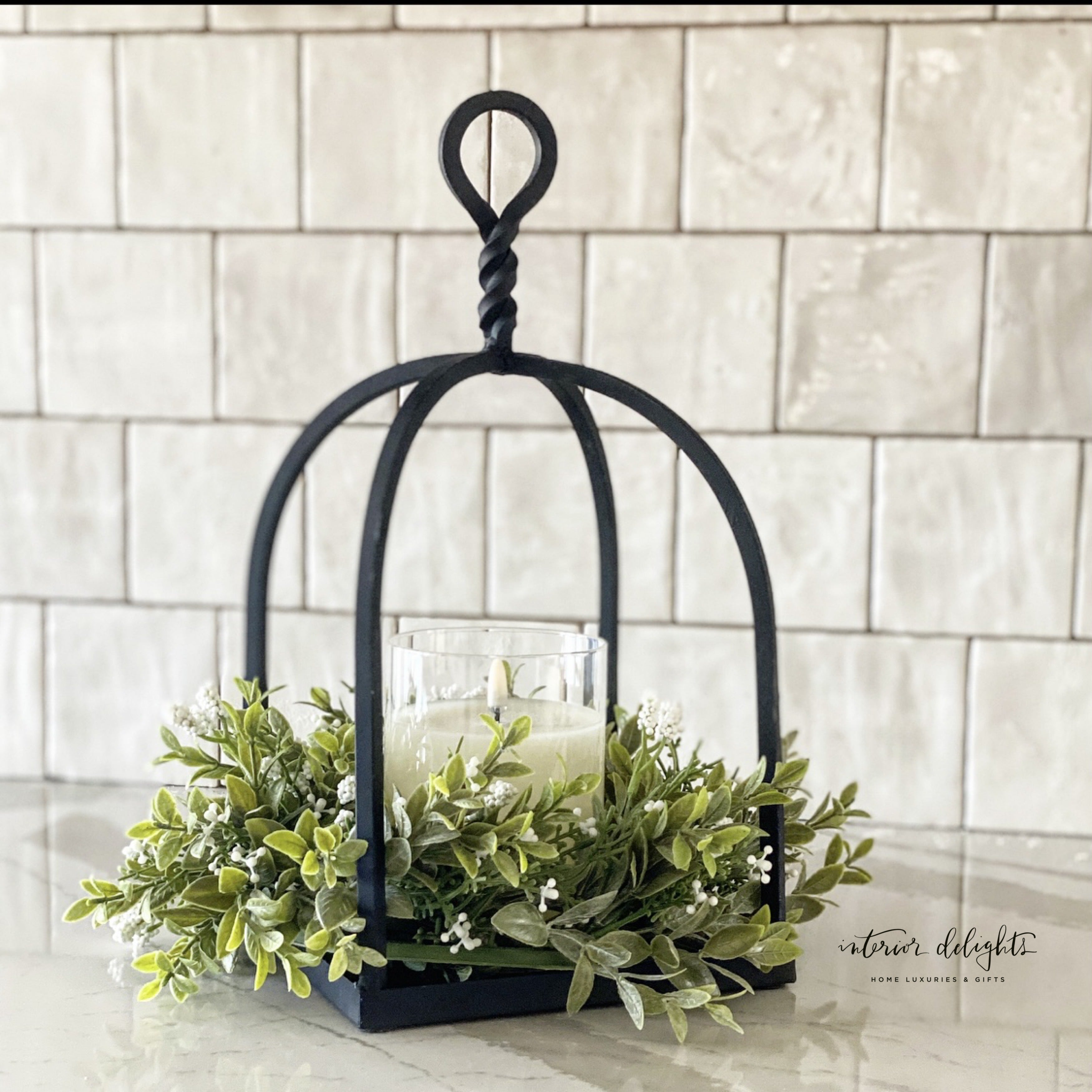 Close-up view of Twisted Top Lantern showcasing its sturdy black iron craftsmanship and design.