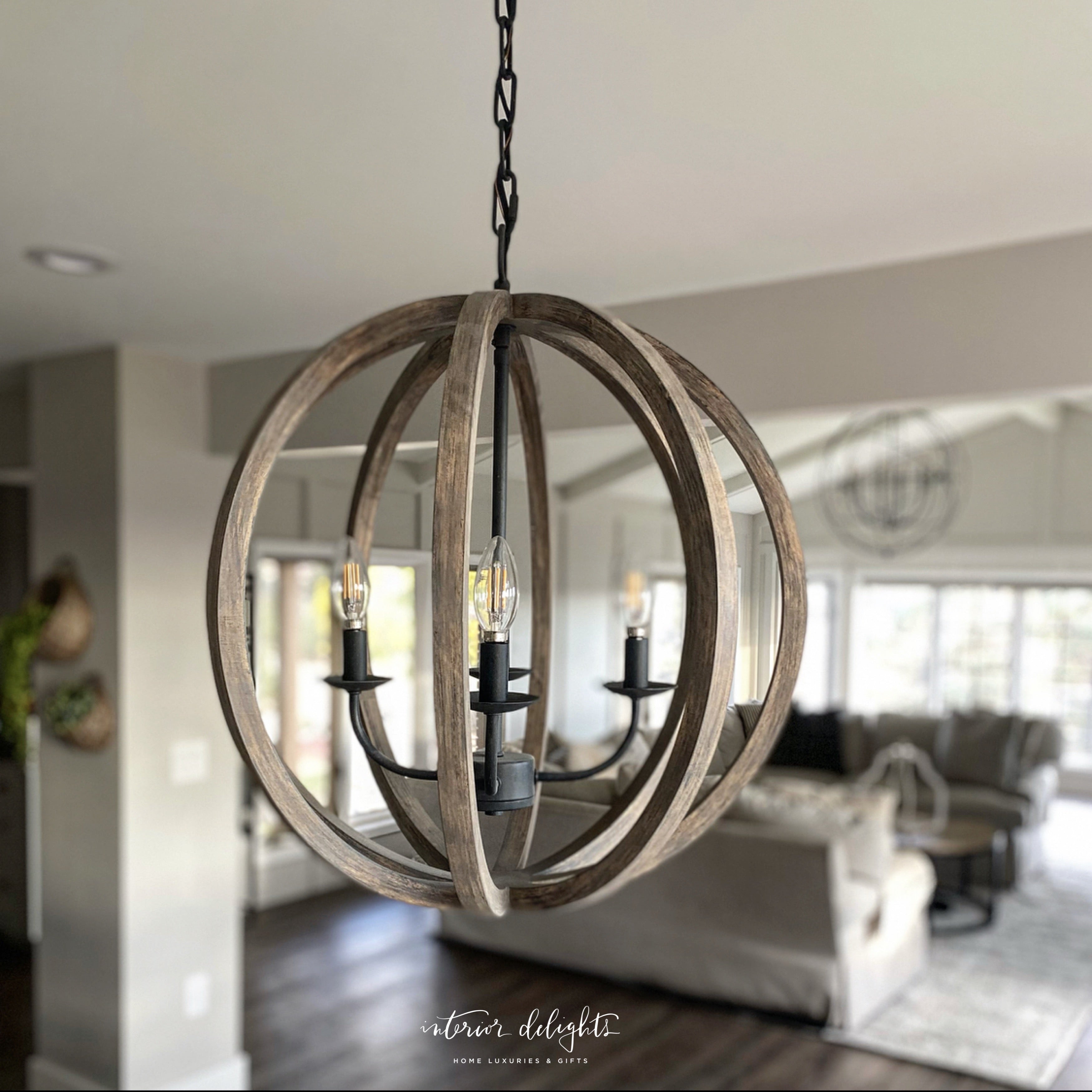 Allister 5 Light Chandelier beautifully hanging above a kitchen table, showcasing its elegant design.