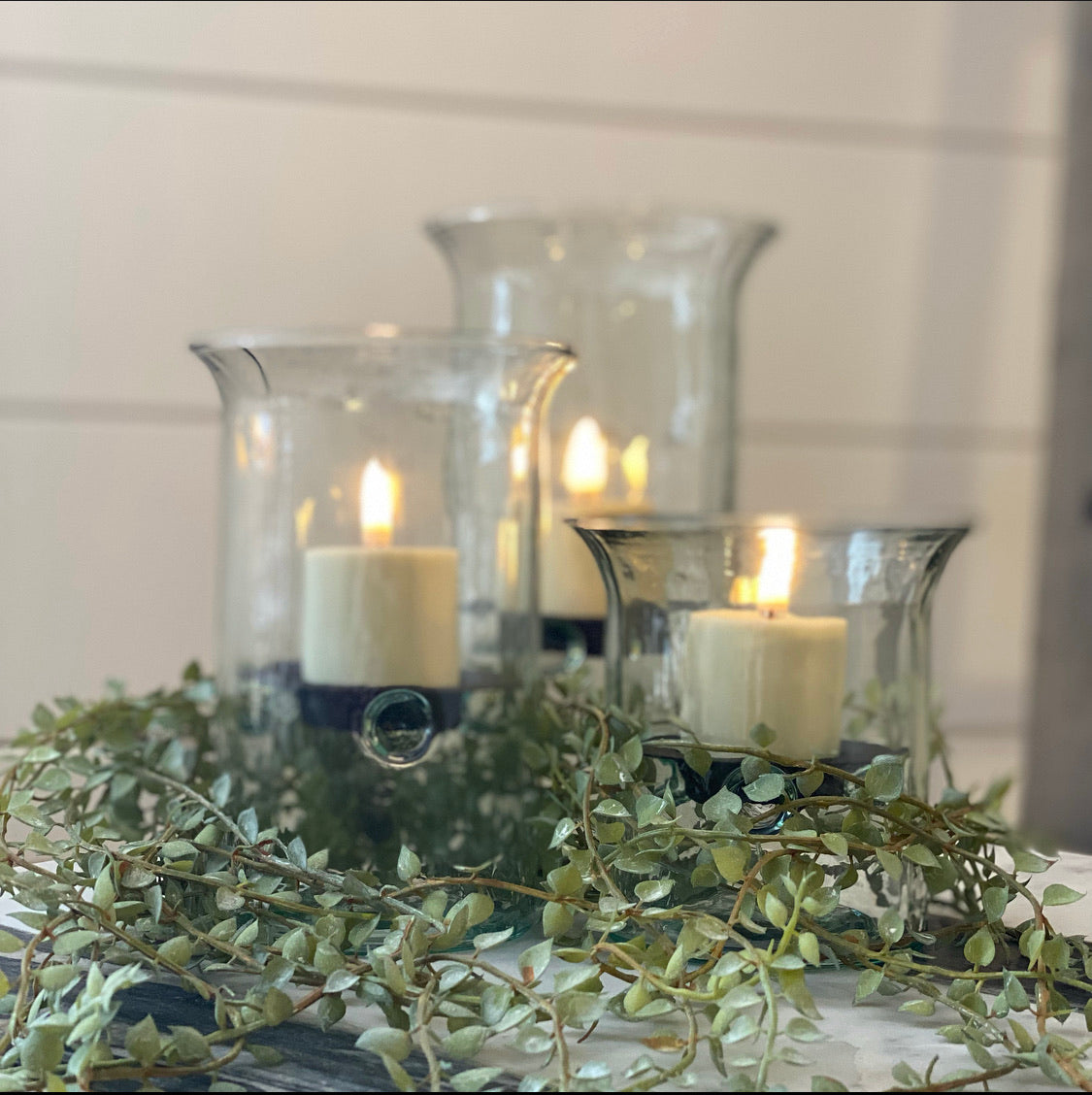 Close-up view of the Rechargeable Flameless Votive Candle Set of 4, showcasing the sleek design and remote control for convenient use.