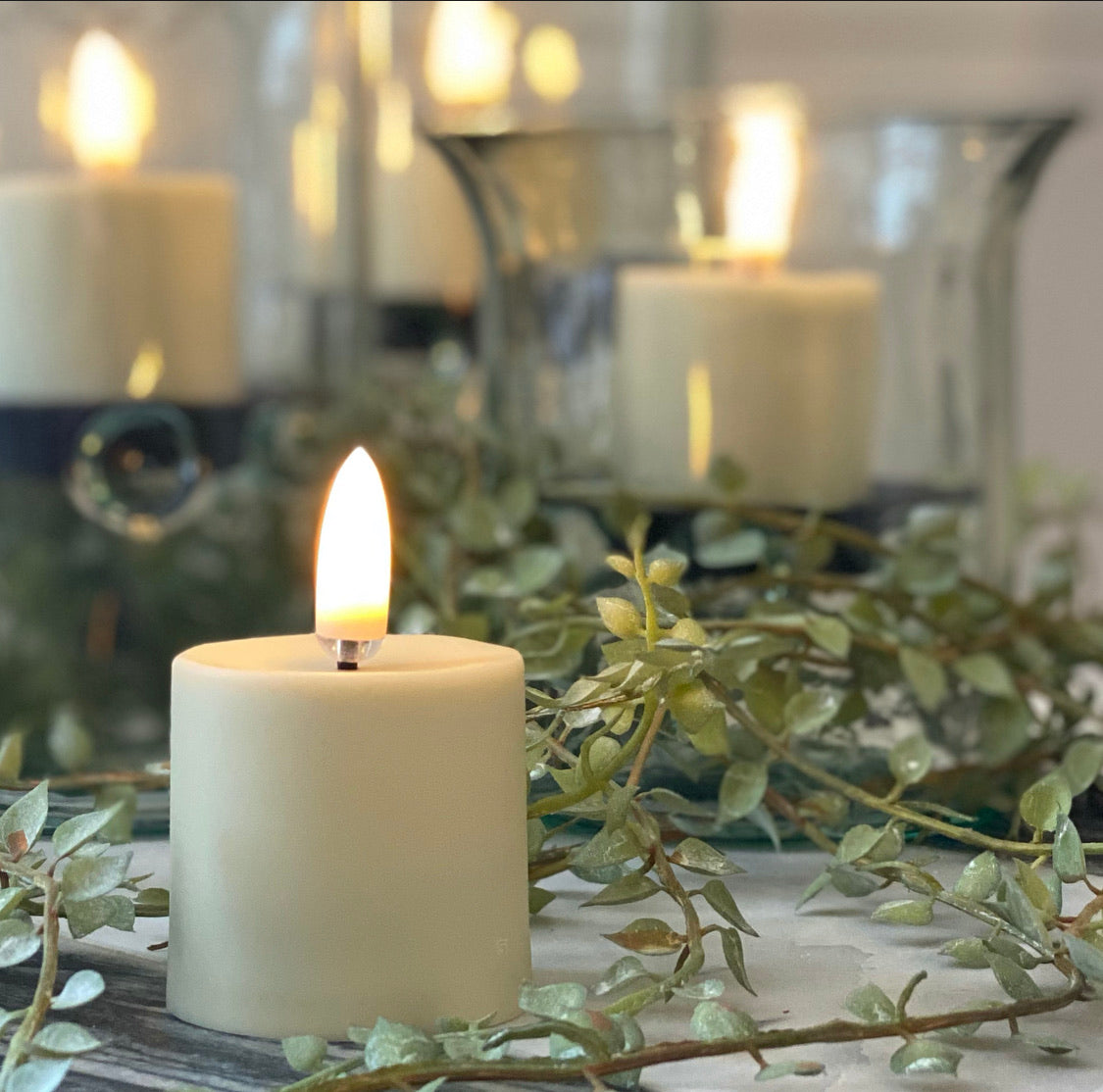 Rechargeable Flameless Votive Candle Set of 4 placed on a table, ideal for creating a cozy atmosphere without the hassle of traditional candles.