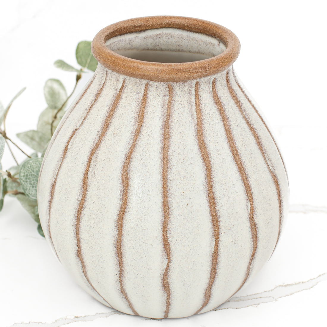 Stylish 7 inch beige stripe ceramic vase showcasing a softly rimmed top and warm, natural tones.