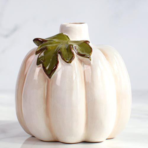 Set of three ceramic pumpkin bud vases, ideal for small stems or seasonal displays in home decor.