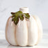 Set of three ceramic pumpkin bud vases, ideal for small stems or seasonal displays in home decor.