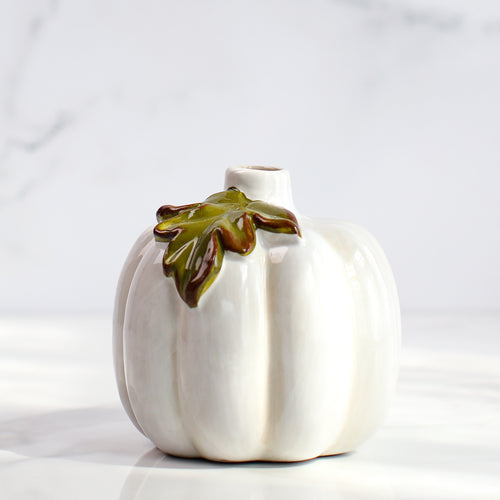 Close-up of the medium ceramic pumpkin bud vase with a slight orange wash, showcasing its unique finish.