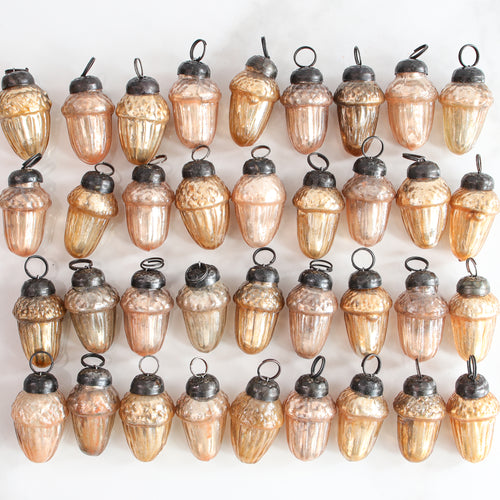 Mercury Glass Mini-Acorn Ornaments Set of 36 featuring vintage-inspired mini-acorns in champagne and light bronze finishes, perfect for fall decor.