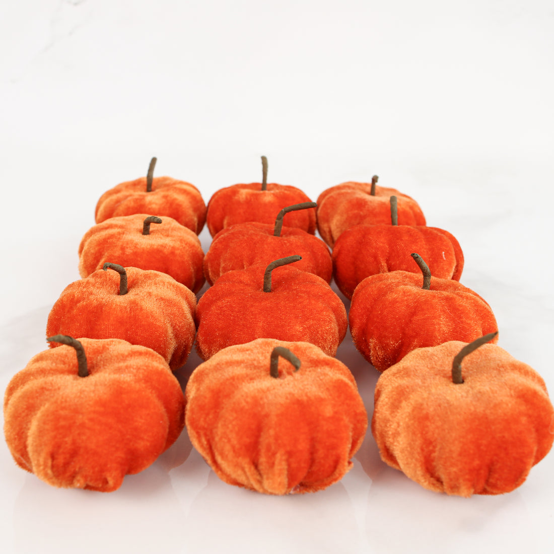 New England Orange Velvet Mini Pumpkins - Set of 12, perfect for adding cozy autumn charm to your decor, featuring soft orange texture and ideal for seasonal displays.