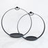 Round Black Metal Open Lantern Set of 2 showcasing two stylish lanterns with a modern design on a table.