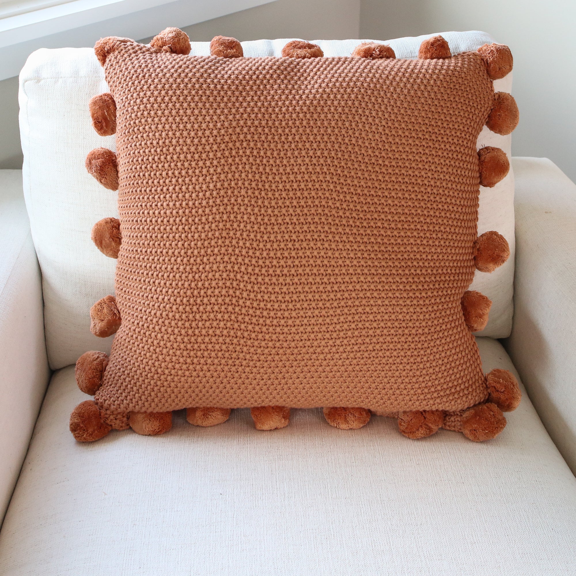 Orange Knit Pillow with Pompom Trim