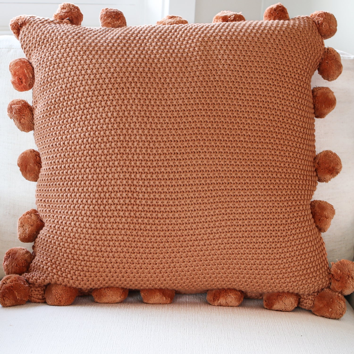 Orange Knit Pillow with Pompom Trim