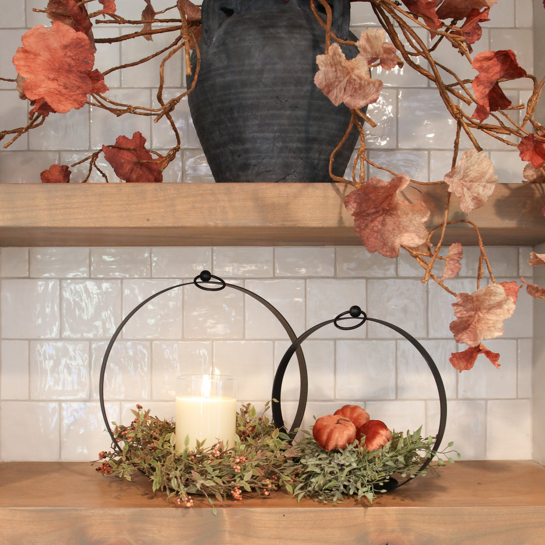 Close-up view of the Round Black Metal Open Lantern Set of 2 featuring intricate metalwork and an airy design.