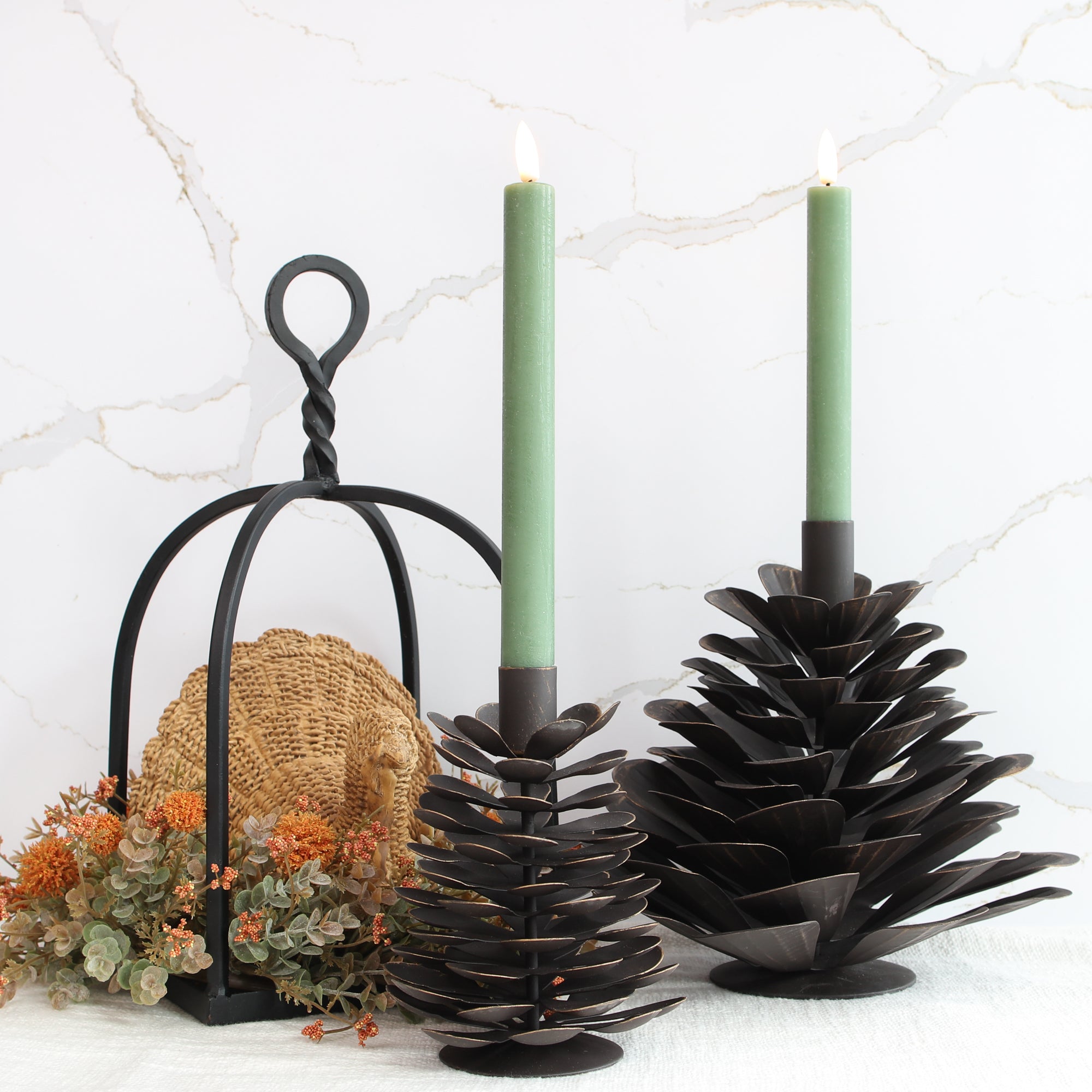 Large Iron Pinecone Candle Holder featuring a rustic design, perfect for cozy autumn settings, crafted from sturdy dark brown iron with bronzed edging.
