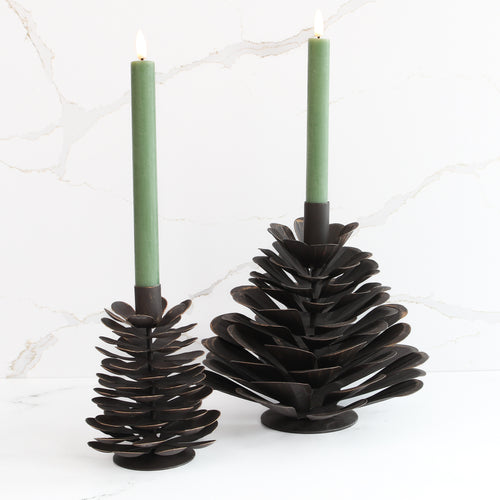 10" LED Taper, Set of 2 Green candles displayed elegantly on a mantel, perfect for seasonal decor.