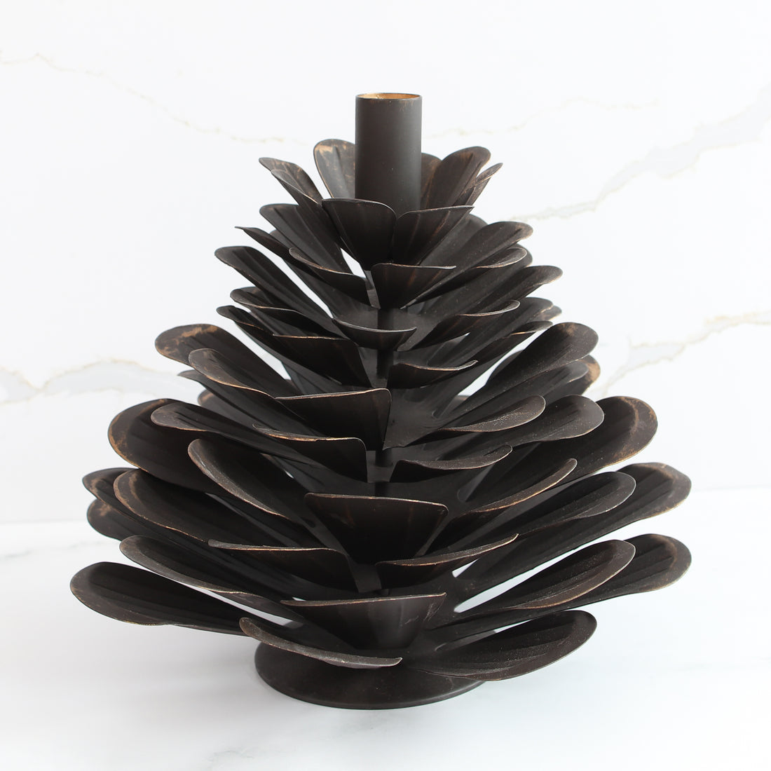 Side view of the Large Iron Pinecone Candle Holder showcasing its sturdy iron craftsmanship.