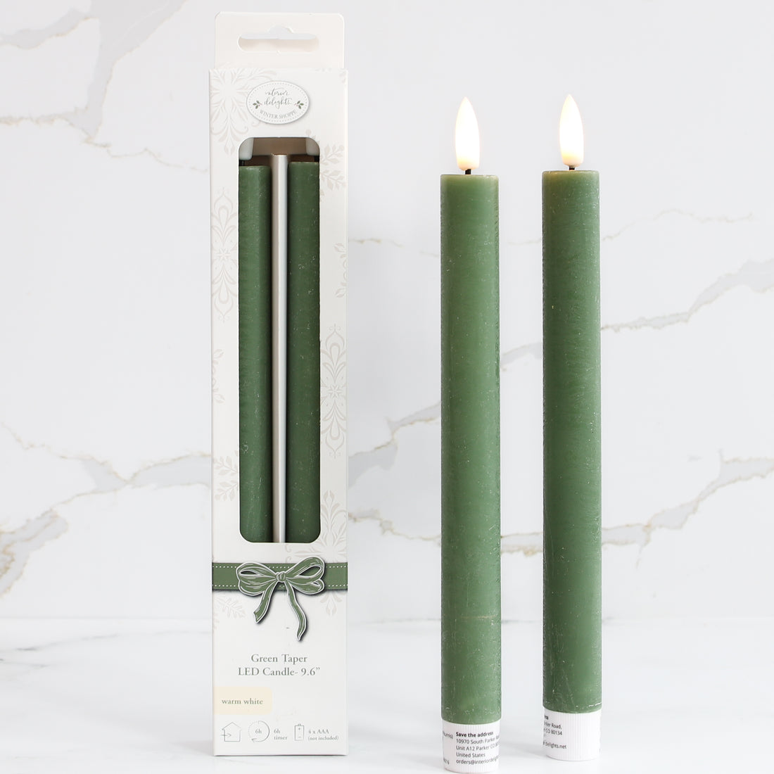 10&quot; LED Taper, Set of 2 Green candles adding elegance to home decor with a warm, flickering glow.