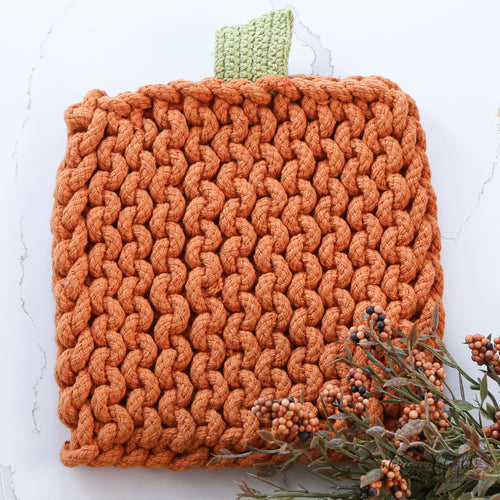 Stylish Pumpkin Knit Pot Holders in two styles, adding a seasonal touch to your kitchen decor.