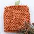 Stylish Pumpkin Knit Pot Holders in two styles, adding a seasonal touch to your kitchen decor.