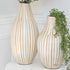 17” or 21” Natural Striped Vases made of durable bamboo, featuring vertical white and natural stripes, ideal for displaying faux flowers in a stylish way.