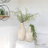 17” or 21” Natural Striped Vases featuring elegant vertical white and natural-toned stripes, made from durable bamboo, ideal for displaying faux stems and coordinating with rustic, modern, or coastal decor.