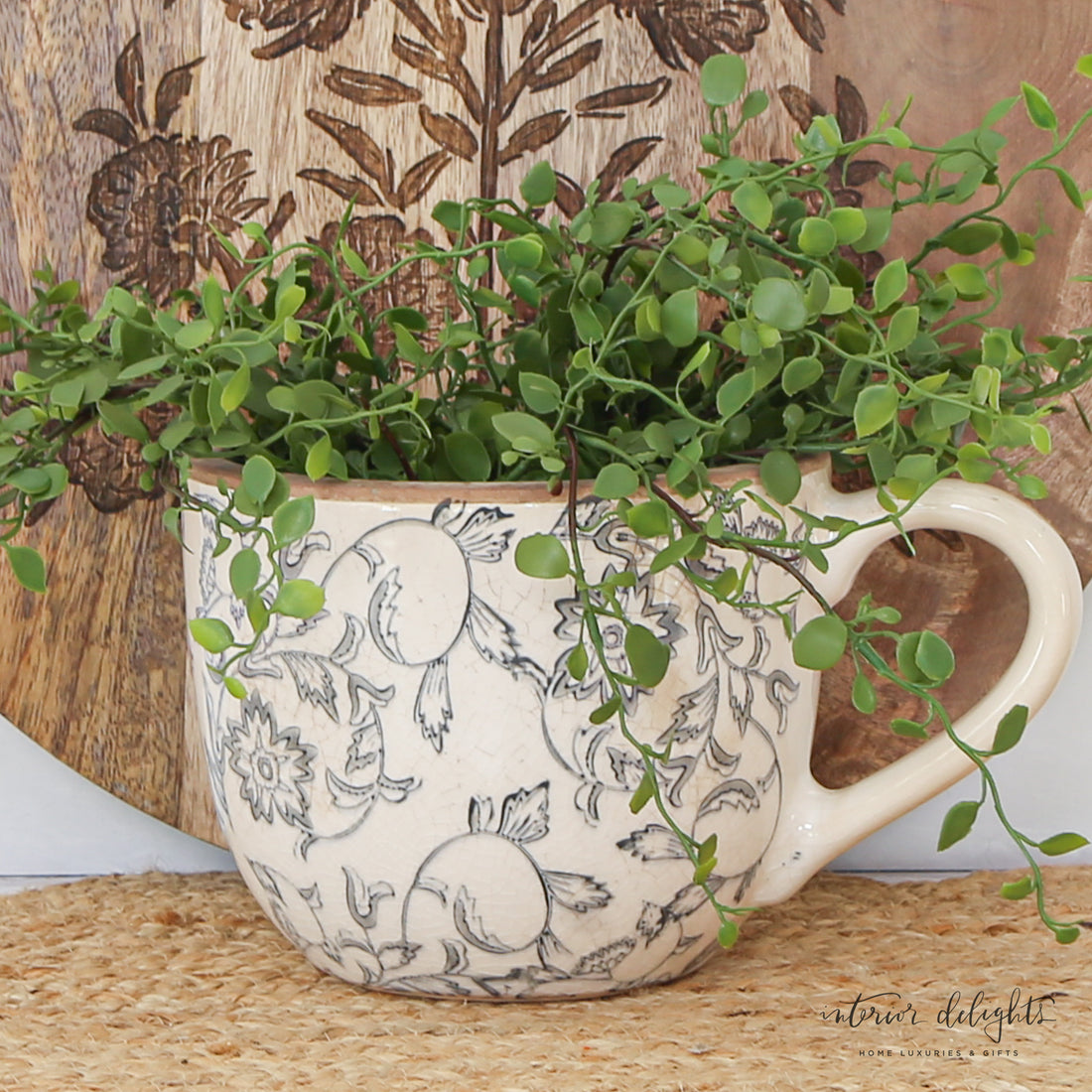 5" Beige Heirloom Tea Cup Planter showcasing vintage charm with intricate glaze pattern, perfect for displaying flowers in whimsical decor.