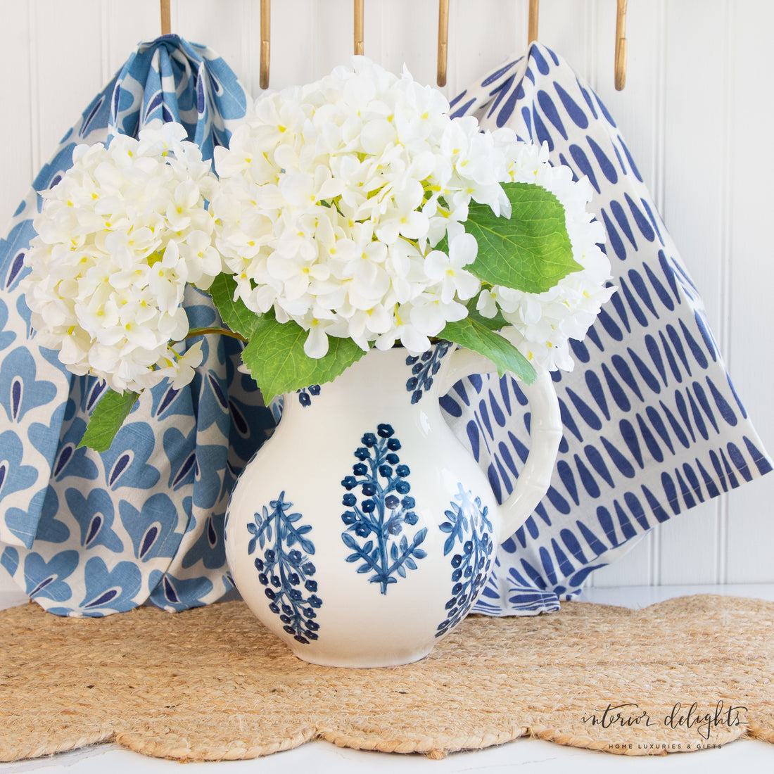 Top view of Block Print Pitcher featuring a blue stripe around the top rim and decorative blue floral design.