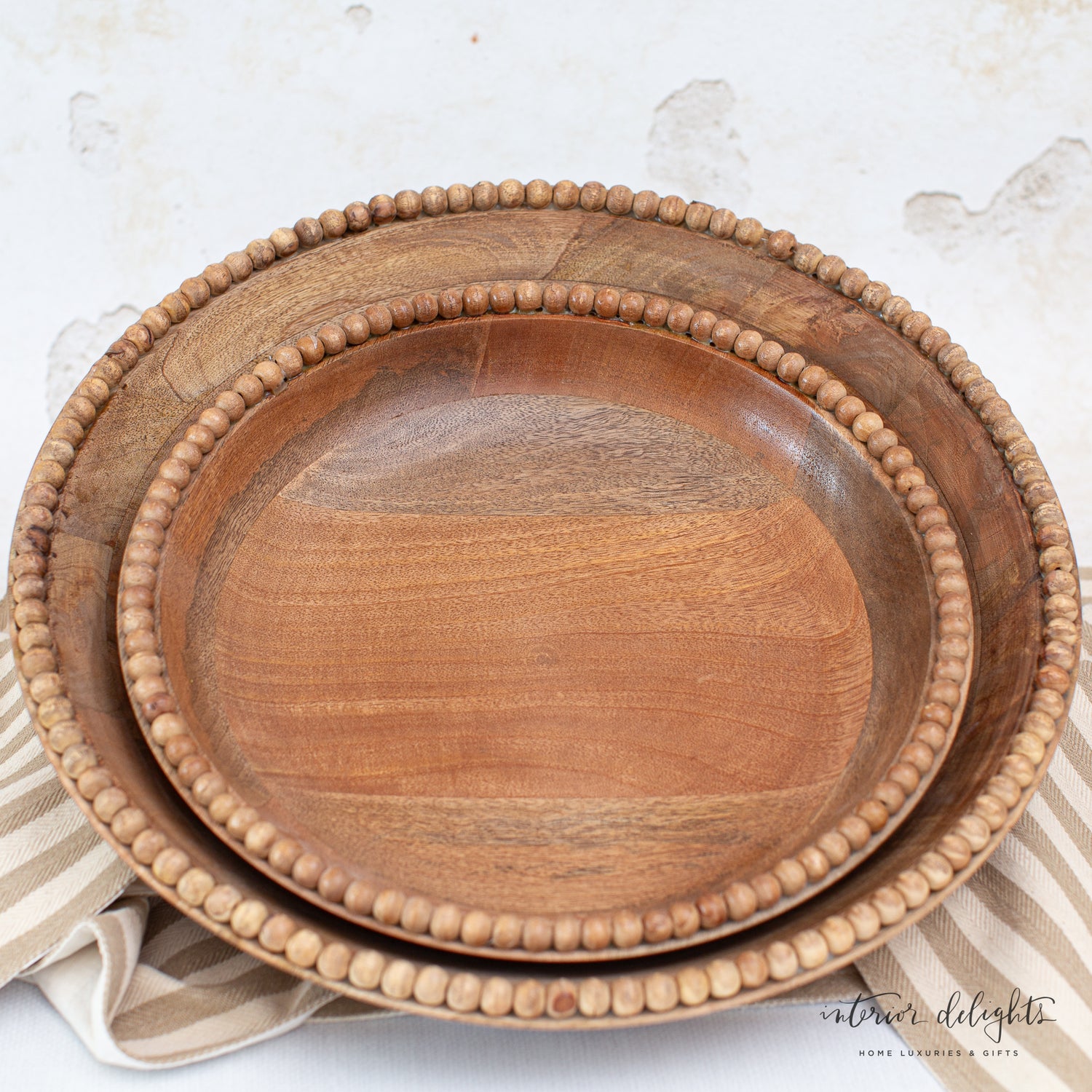Close-up of the Wood Beaded Nesting Trays Set of 2, highlighting the natural wood and hand-beaded detailing.
