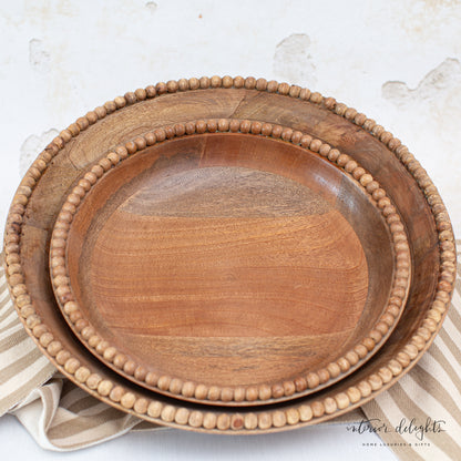Close-up of the Wood Beaded Nesting Trays Set of 2, highlighting the natural wood and hand-beaded detailing.