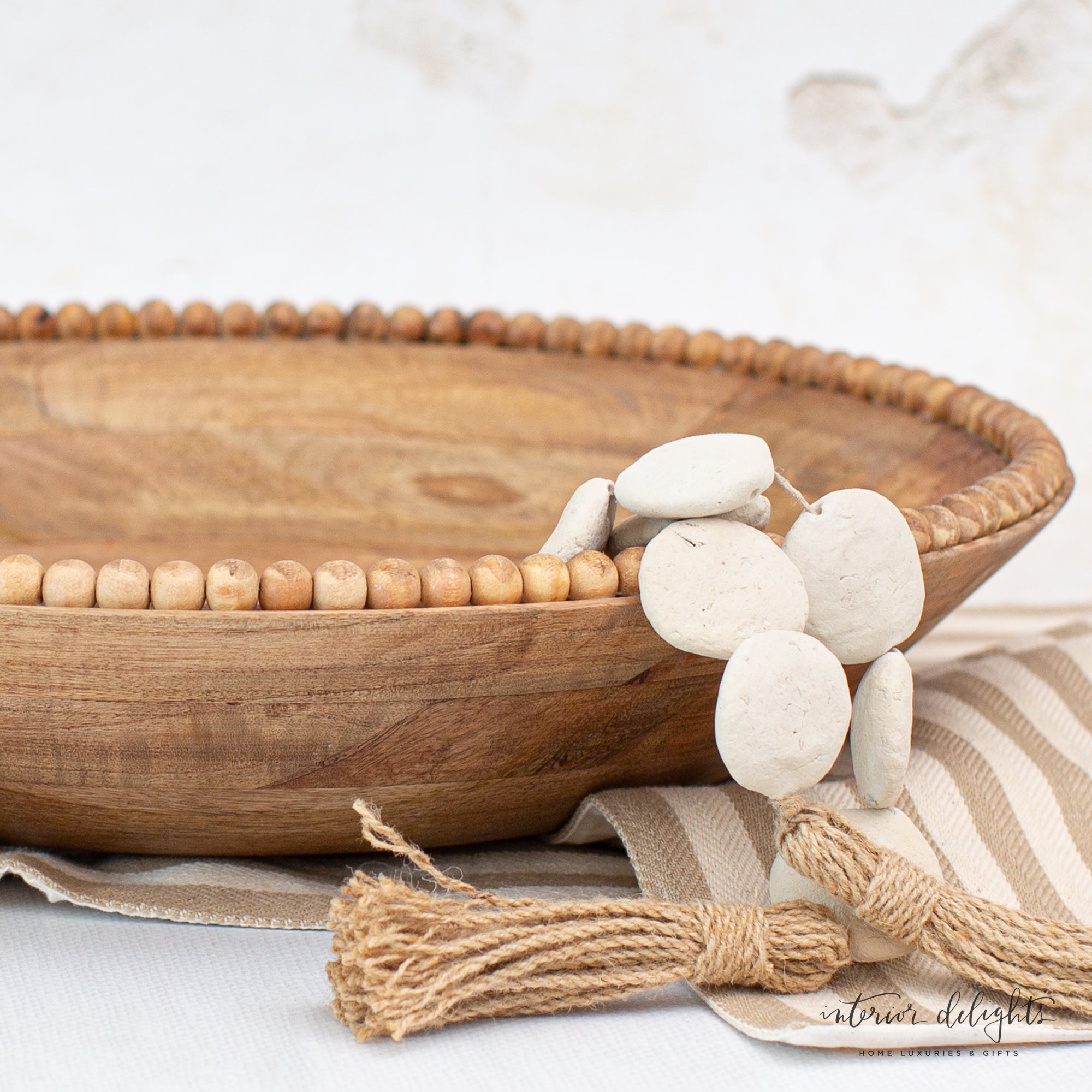 Dimensions of the Wood Beaded Nesting Trays Set of 2, with large bowl measuring 18&quot; D and small bowl measuring 14.25&quot; D.