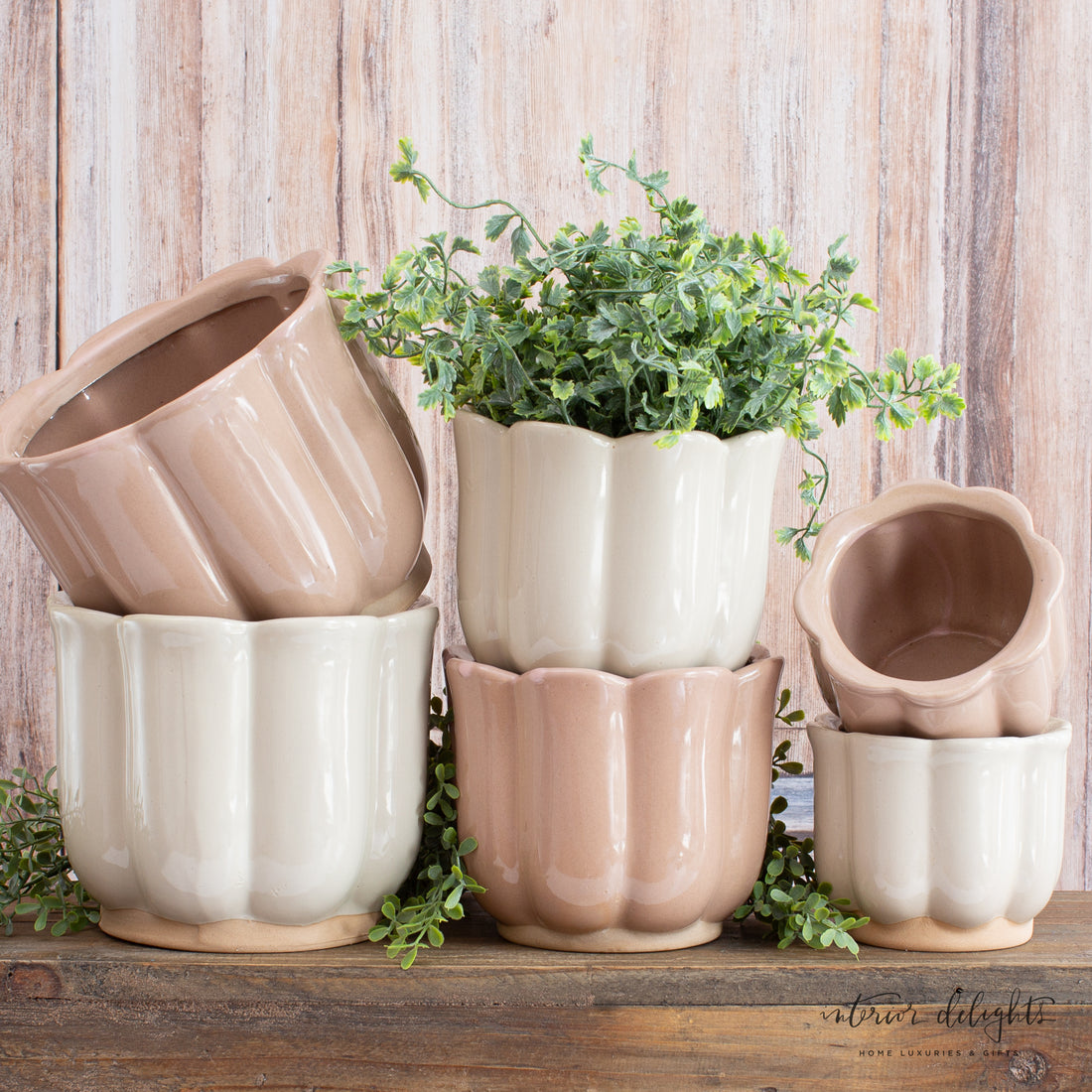Close-up view of the light beige color and unique floral design of Beige Stoneware Planters.
