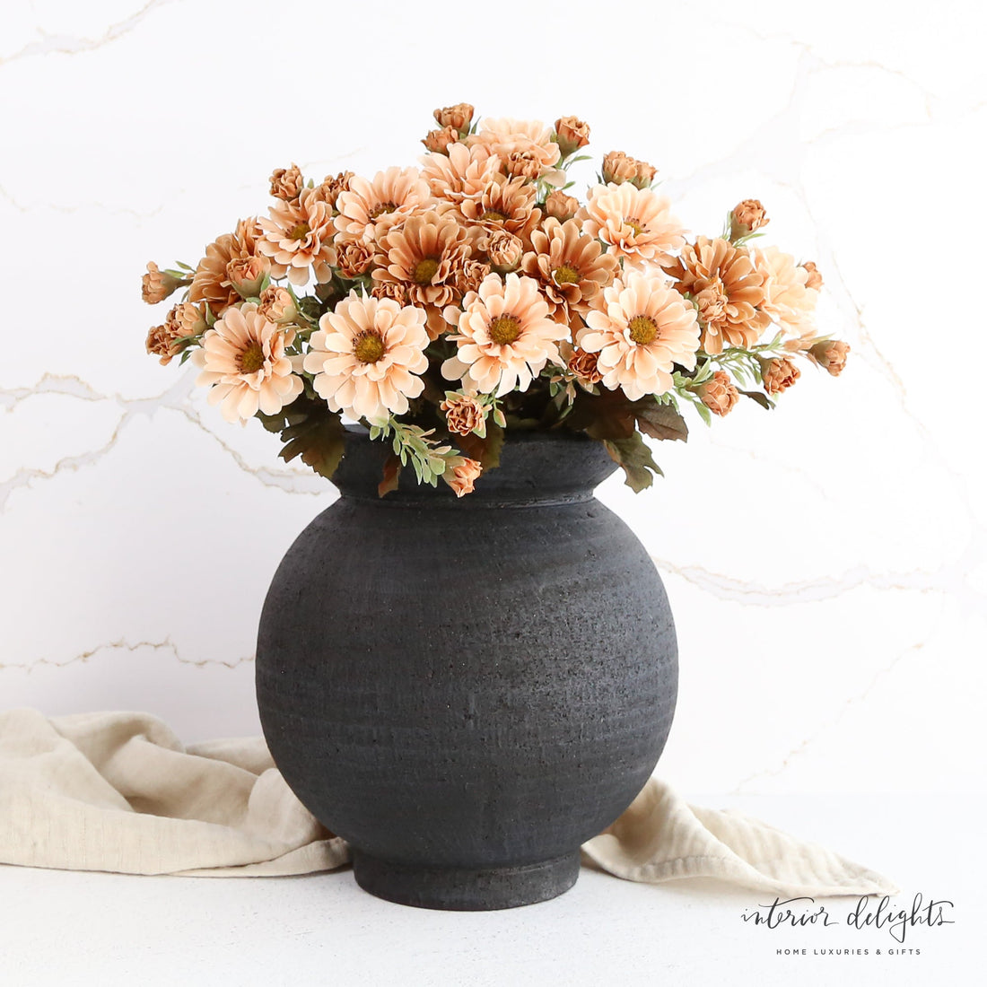 The 9.5" Black Paul Vase with a stylish round shape, ideal for holding decorative plants and enhancing home decor.