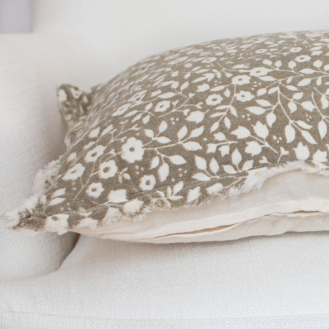 Beige Floral and Leaf Lumbar Pillow- 14in x 20in with a coordinating beige back and zipper closure.