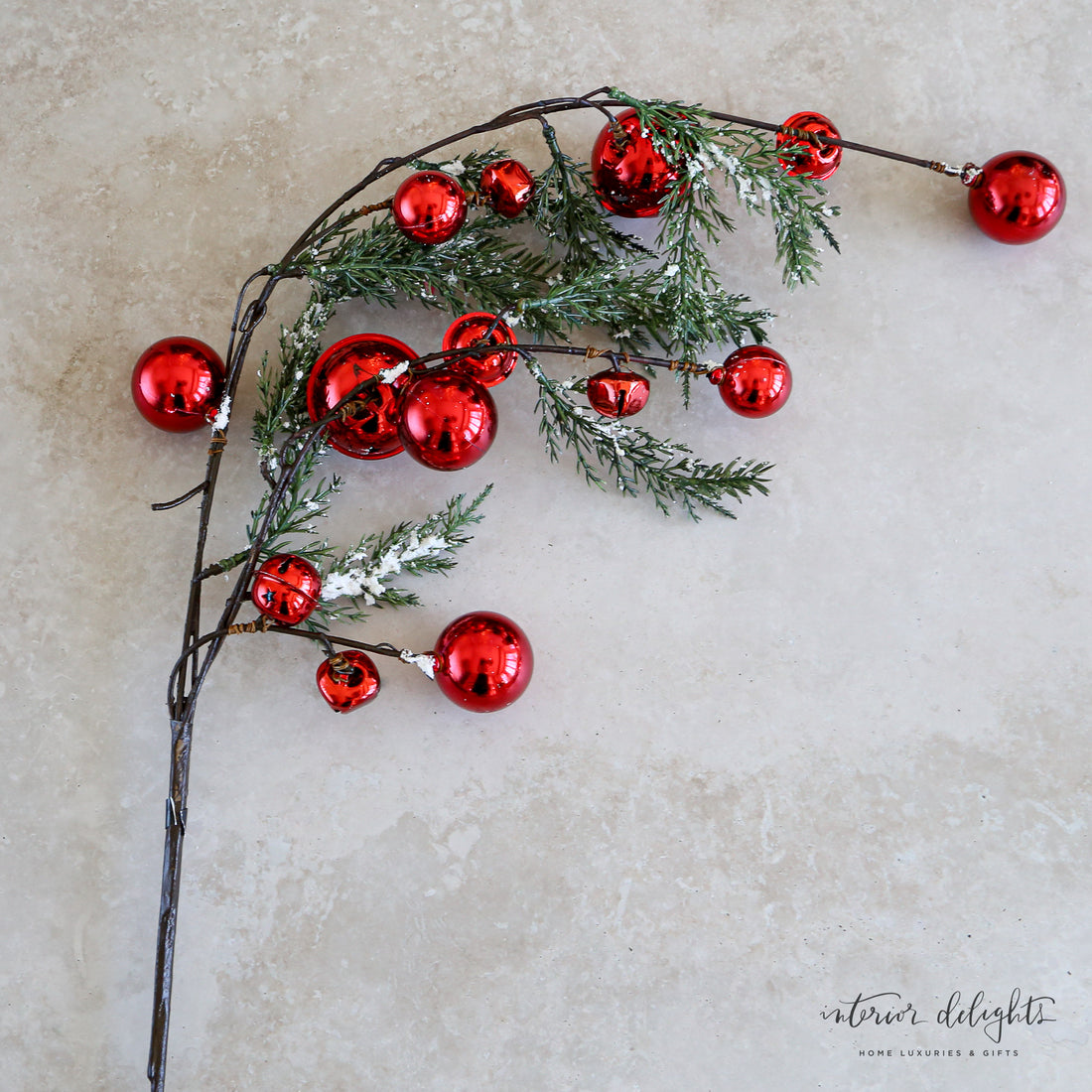 35" Snowy Pine Branch With Red Bells, featuring snowy pine needles and vibrant red jingle bells, perfect for holiday decor.