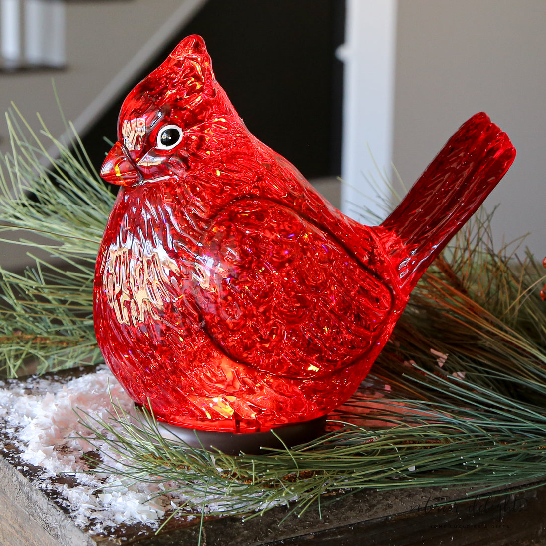 Cardinal Snow Globe with swirling glitter effect, perfect for holiday decor.