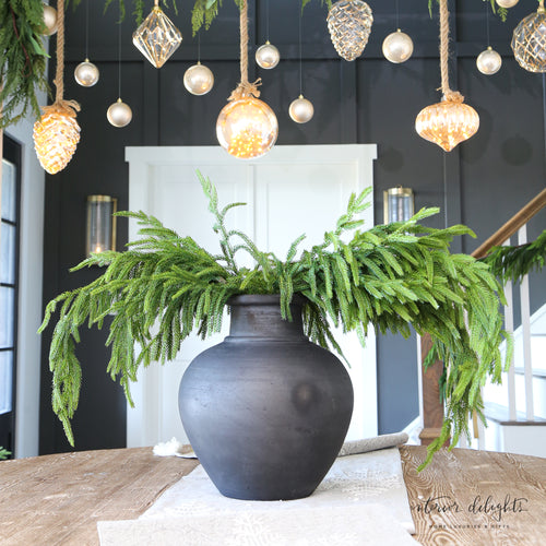 38” Natural Touch Norfolk Pine Spray in a decorative vase, showcasing realistic needles for holiday decor.