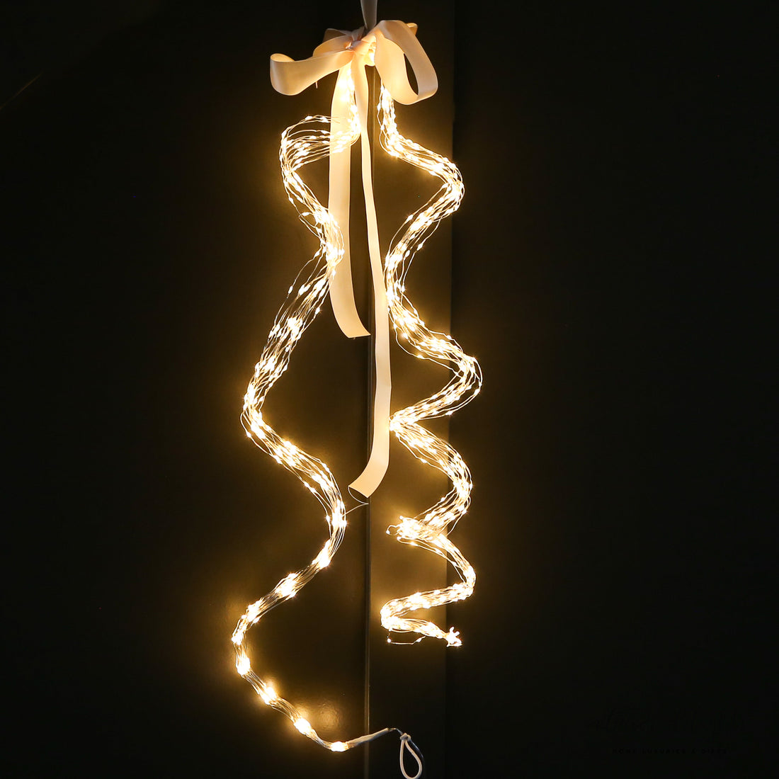 Close-up of the Game Changer Micro LED Tree Bunch showcasing its warm twinkling lights and cascading design.