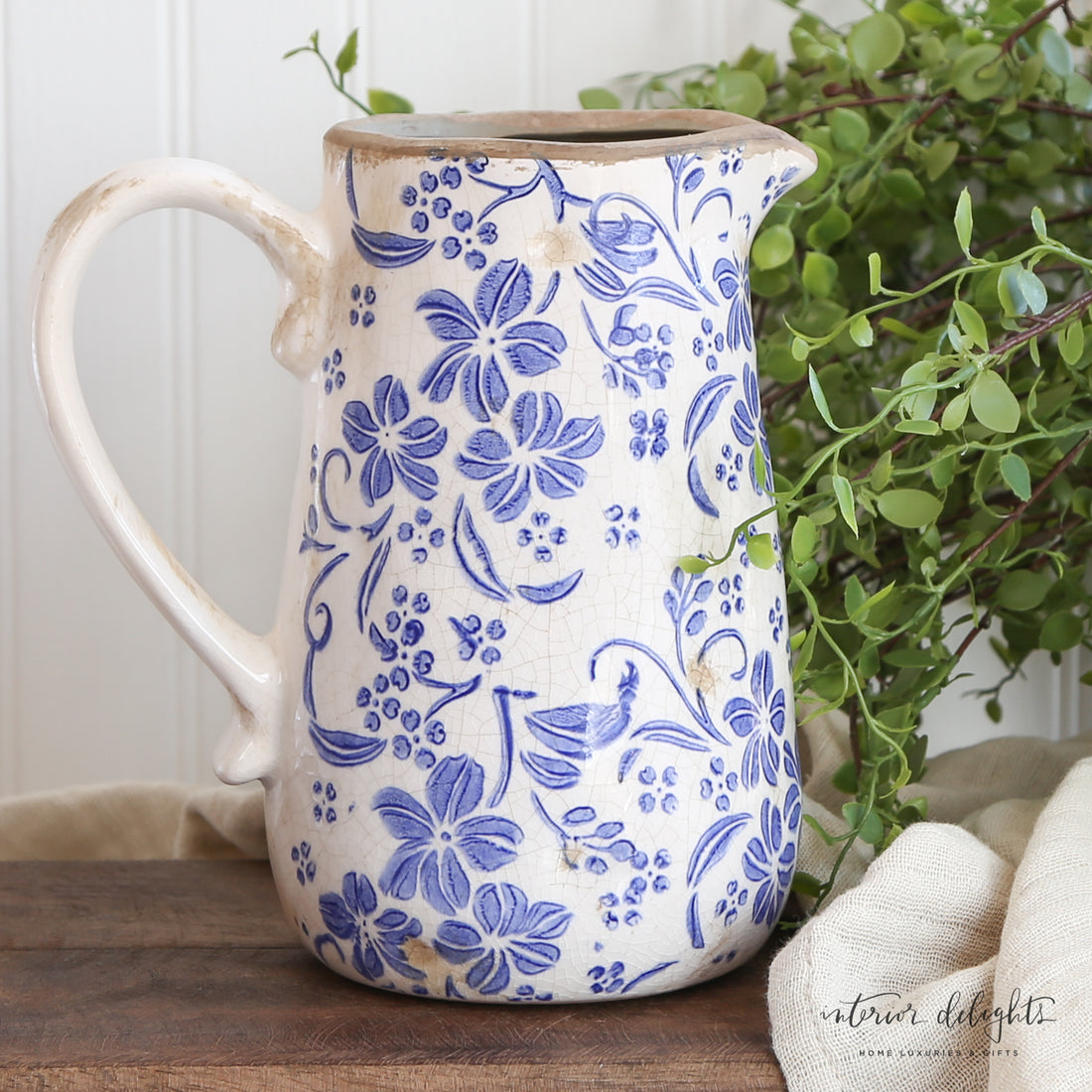 Ceramic Blue Floral Pitcher with delicate blue floral design, perfect for vintage decor.
