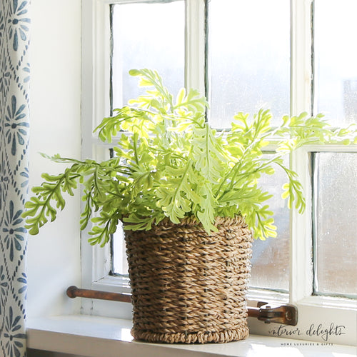 10-inch Green Fern in Basket, a lifelike faux fern showcasing vibrant greenery, perfect for adding a natural touch to decor.