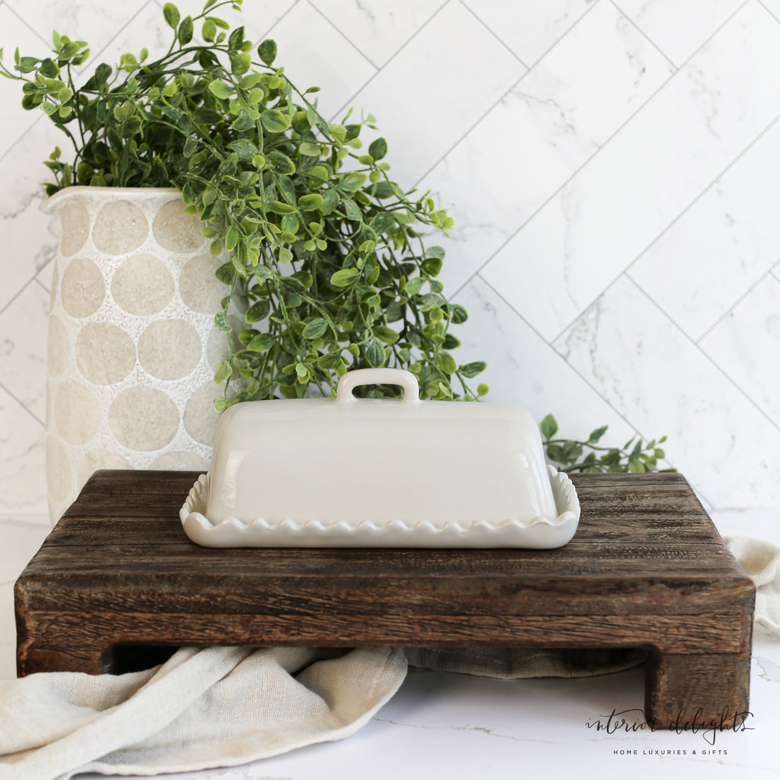 White Scalloped Butter Dish designed for one stick of butter, showcasing its charming scalloped edges and versatile stoneware design.