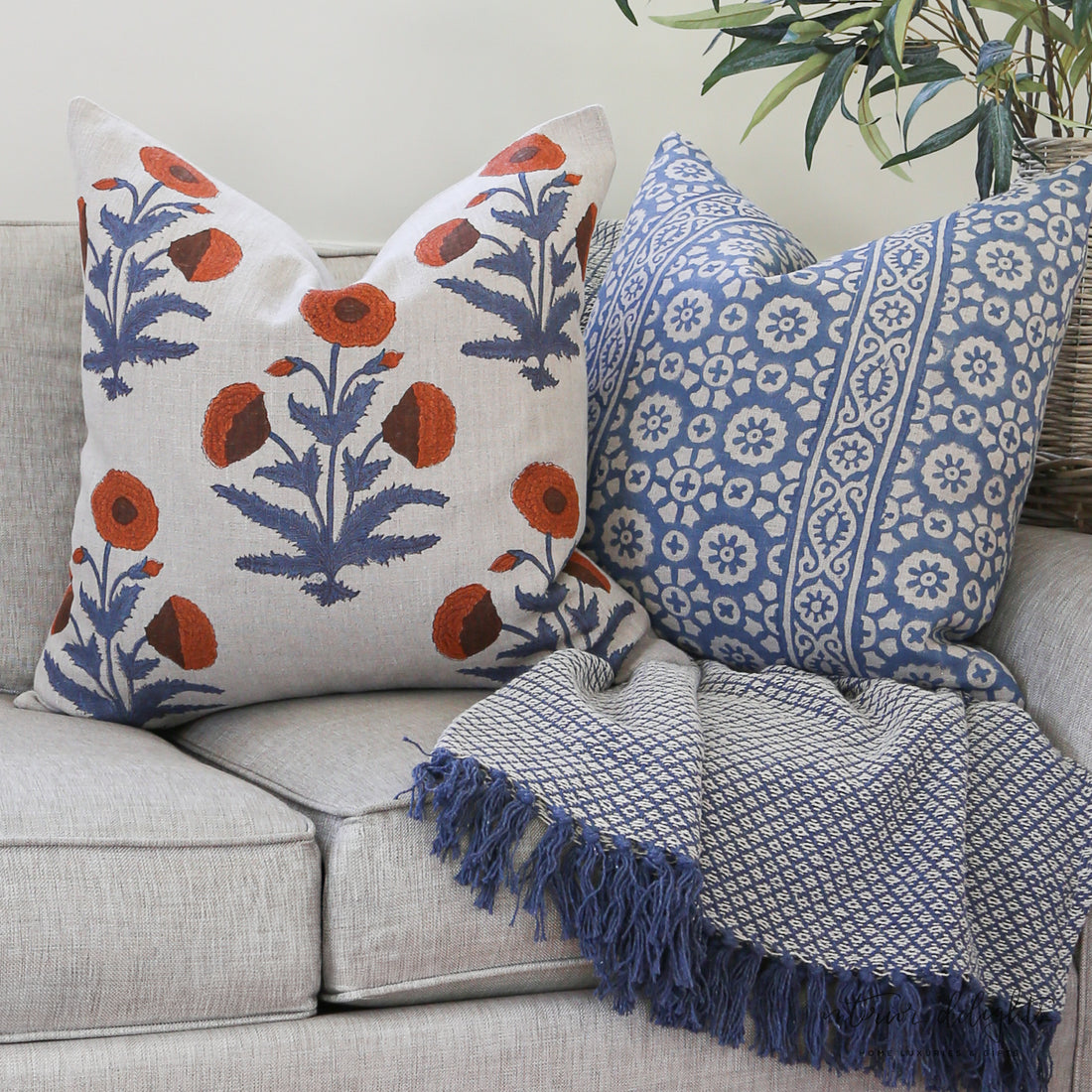 Cozy setup featuring Luxe Bleu Médaillon Pillow Cover alongside complementary Luxe Poppy Pillow Cover and Luxe Blue Fleurette Pillow Cover, highlighting elegant home decor.