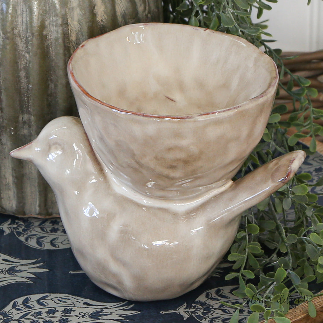 Closeup of the Stoneware Bird with Bowl - Cream, showcasing its glazed finish and elegant design.