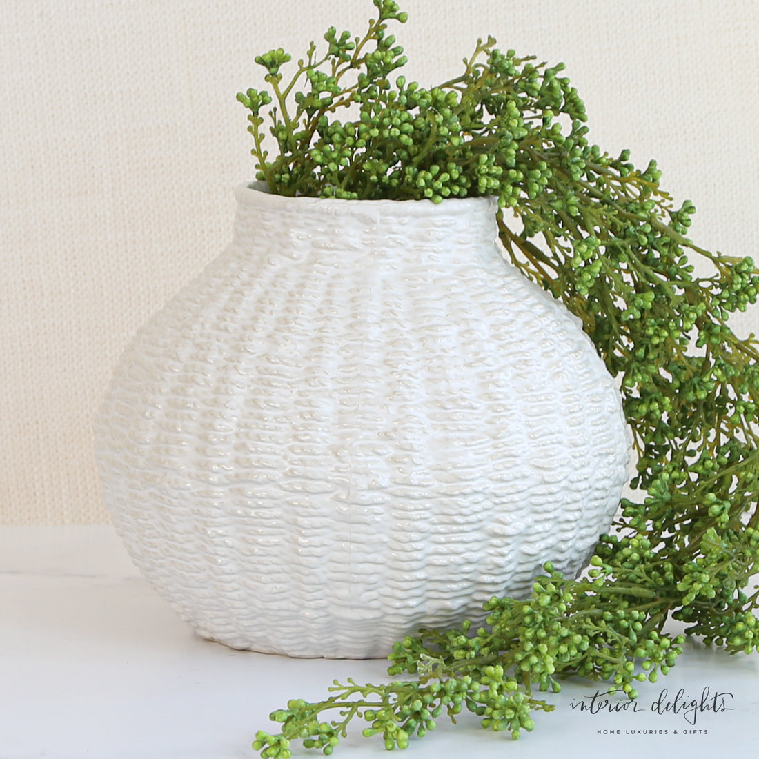 6” or 7” Woven Ceramic Round Vases displayed on a table, beautifully complementing a coastal-style interior.