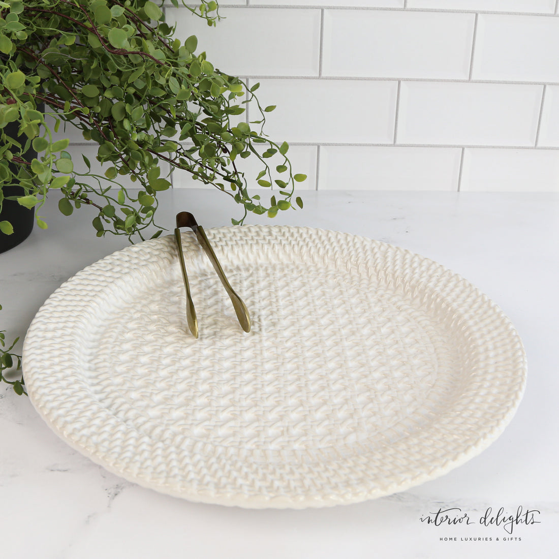 Woven Stoneware Platter showcasing its elegant basket-inspired ceramic design with 5.75&quot; brass serving tongs, perfect for serving hors d&