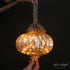 Close-up of Luster Glass LED Individual Ornament highlighting warm lights, perfect for seasonal decorations.