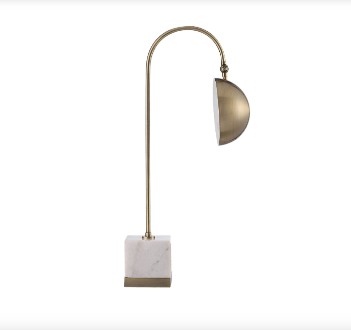 Folding Brass and Marble Table Lamp displayed in a cozy home setting, showcasing its dimensions and warm lighting.