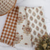 Autumn Block Print Tea Towels set of 3 featuring unique orange gingham, large floral, and small floral patterns, perfect for adding charm to your seasonal kitchen decor.