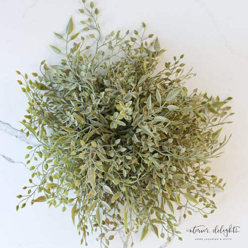 10" Mixed Sage Pouf showcasing its versatile design, perfect for extra seating or as a stylish footrest in your living room.