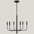 Elegant Stacie 6 Light Curved Arm Chandelier displayed in a cozy home setting, emphasizing its striking presence.