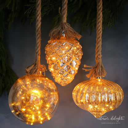 Luster Glass LED Individual Ornaments in Pinecone and Onion styles, adding a festive glow to your Christmas tree decorations.