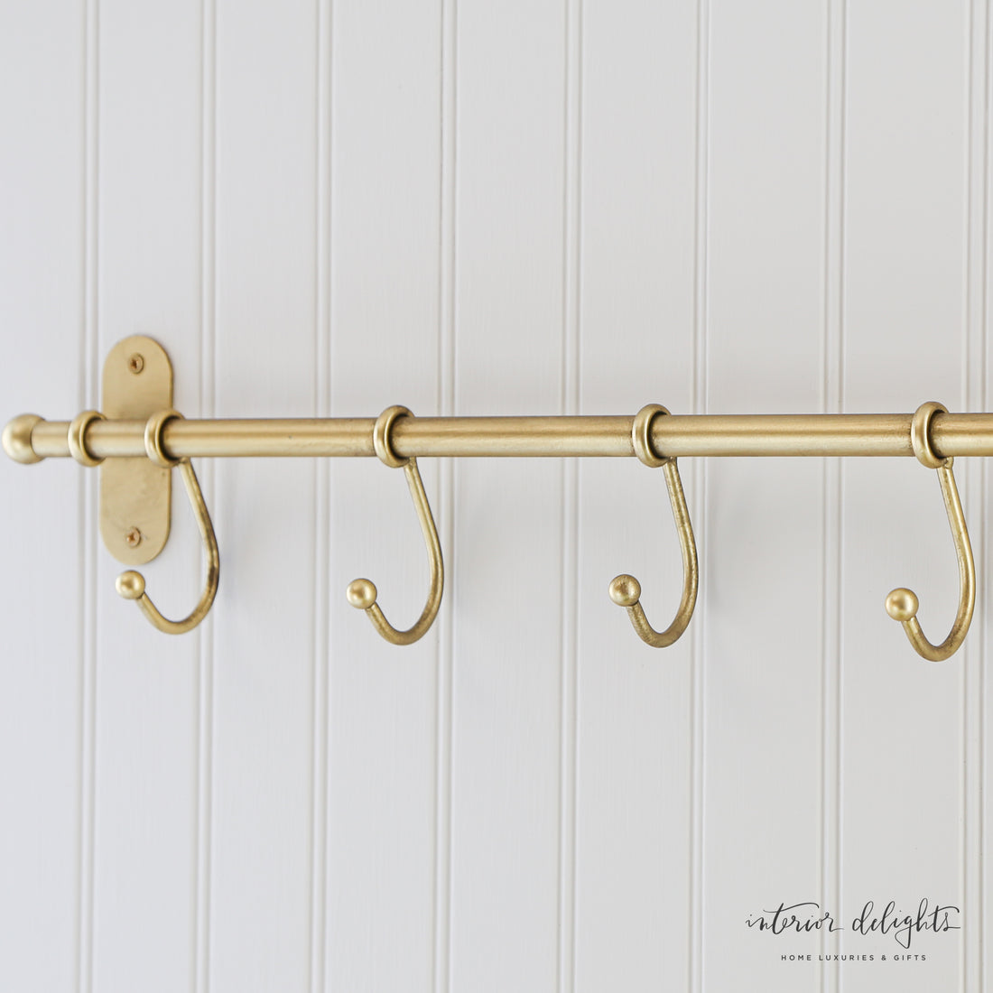 Antiqued Metal Wall Hooks, featuring five sturdy hooks for organizing coats and kitchen items, perfect for adding vintage charm to any space.