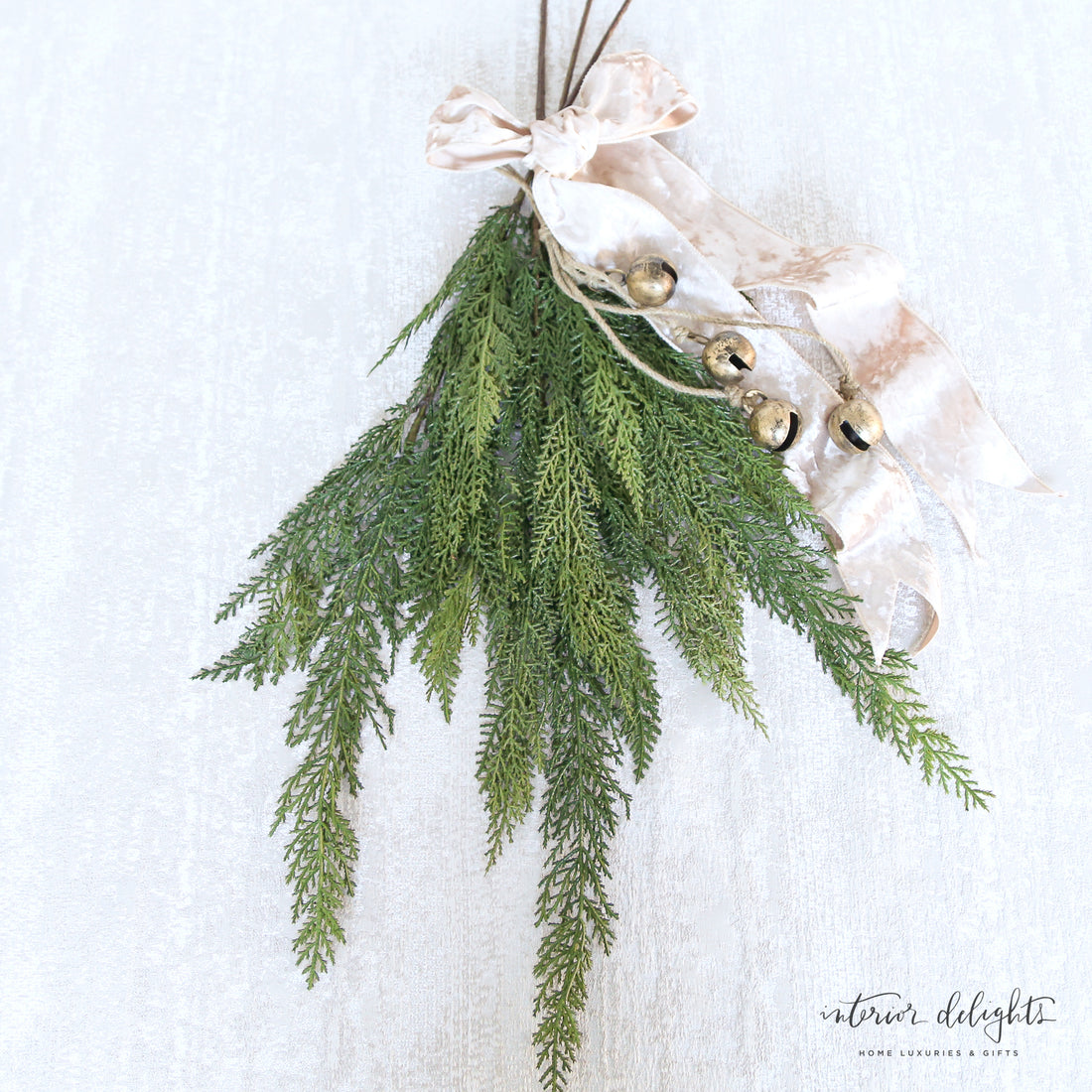 30" Cedar Spray elegantly displayed in a modern vase, showcasing its natural greenery and texture.